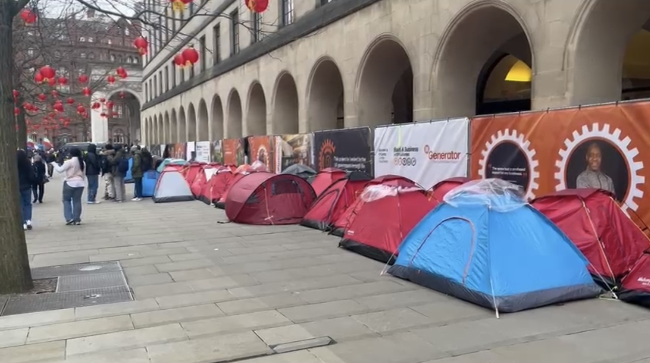 Different coloured tents outside Manchester Town Hall