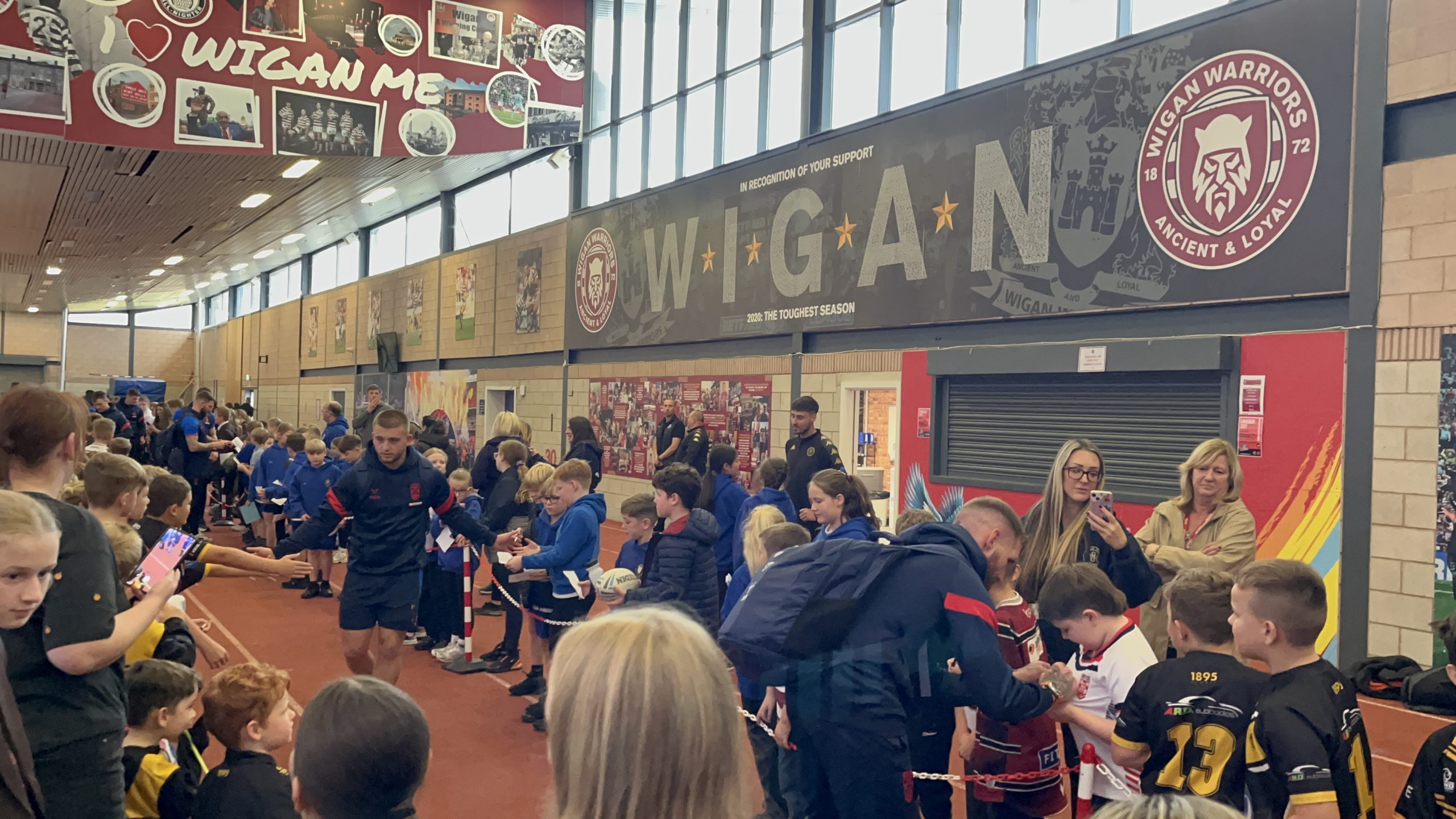 Local schools create 'Guard of Honor' for the England squad.